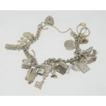 Silver charm bracelet and 18 charms