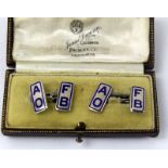 A pair of silver and enamel cufflinks in fitted case