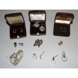 9 pairs of silver and gold earrings
