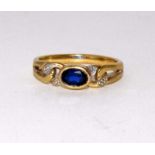 9ct gold ladies diamond and blue sapphire ring size O