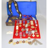 A leather Masonic case containing a large amount of Regalia and over twenty Medals & Jewels
