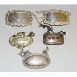 Two silver decanter labels and three others
