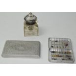 Trench art cigarette box, a glass ink well and a collection of fishing flies