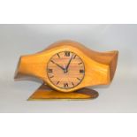 An impressive WW1 trench art clock made from a laminated wooden propeller boss and standing on a