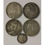 A group of five English silver coins, comprising a George IV crown 1821, three Victoria Jubilee Head