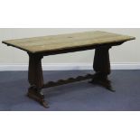 A 20th Century oak refectory table, the rectangular top on shaped supports, height approx 72cm,