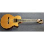 A Tanglewood electro-acoustic nylon-string guitar, serial no. 97032288, with a vinyl carry-bag.