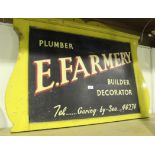 A mid-20th Century painted softwood advertising sign for 'E. Farmery, Plumber, Builder, Decorator,