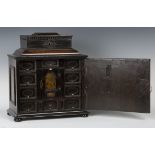A late 17th Century Continental ebonized and walnut table-top collector's cabinet with applied Dutch