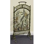 A late Victorian green painted faux bamboo framed firescreen, inset with a glazed panel of