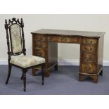 A 20th Century reproduction mahogany twin pedestal desk, the serpentine front fitted with nine