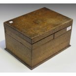 An early 20th Century oak work box, the hinged lid enclosing a pair of hinged trays, width approx