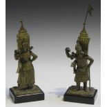 A pair of 19th Century French patinated cast bronze figural vesta holders, each in the form of a