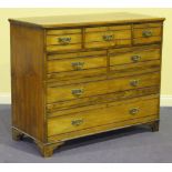 An Edwardian oak chest of five short and two long drawers, on bracket feet, height approx 100cm,