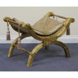 A 20th Century giltwood 'X' frame stool with carved decoration, width approx 77cm.