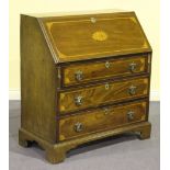 A 19th Century mahogany bureau with inlaid shell and fan paterae within crossbanded borders, the