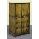 An early 20th Century walnut tallboy with crossbanded borders and serpentine front, fitted with a