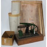 A model of a single cylinder ME beam engine with 23cm spoked flywheel, finished in green and