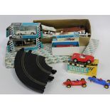 A collection of Scalextric and other slot cars and accessories, including an Aston Martin DB4 GT