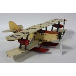 A Meccano Constructor Aeroplane, built as a triple engine sea biplane, finished in red and cream,