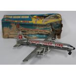 A Marx Toys tinplate battery operated swing tail airplane 'Flying Tiger Line', wingspan approx 49cm,
