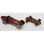 A Chad Valley tinplate clockwork racing car and driver, finished in red with race number 410, length