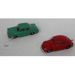 A Dux plastic clockwork Volkswagen Beetle, finished in red, length approx 11.5cm, and a coupé,