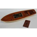 A Kellner clockwork speedboat, with wooden deck and cream painted hull, length approx 71cm, together