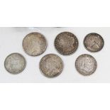 A collection of mostly foreign coins, including two USA dollars, comprising 1921 and 1923, a