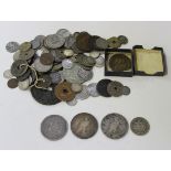 A collection of British and foreign coins, including a George III crown 1819, two USA dollars,