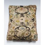 A 17th Century silkwork and metal thread rectangular cushion, one side decorated with an exotic