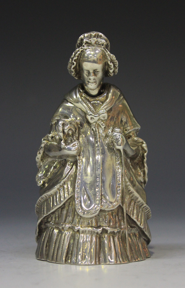 A George V Scottish silver novelty nodding head desk bell in the form of an elderly lady wearing