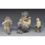 Two Royal Copenhagen porcelain figures of fauns, comprising a seated figure of Pan playing pipes,