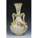 A Royal Worcester bone china cream ground two handled vase, circa 1892, the floral decorated