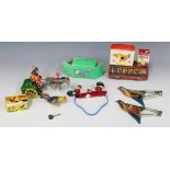 A small collection of tinplate toys, including a pair of Indian Singing Birds, a Russian clockwork