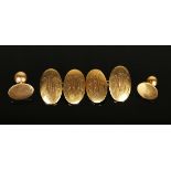 A pair of 18ct gold oval dished cufflinks, monogram engraved, Birmingham 1920, and two gold dress