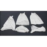 A collection of mainly Victorian white linen infants' clothes, including christening gowns,