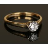 A gold, platinum and diamond single stone ring, claw set with a circular cut diamond, detailed '18ct