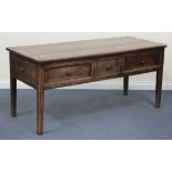 An 18th Century provincial elm serving table, the rectangular top above two end drawers and a