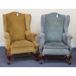 A near pair of early 20th Century Queen Anne style wing back armchairs, on carved cabriole legs with