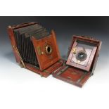 A late 19th Century mahogany and lacquered brass folding plate field camera with black leather