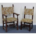 A set of twelve French walnut dining chairs with upholstered seats and backs, raised on block legs