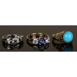 A 9ct white gold, sapphire and colourless gem set ring in a twist design, a gold ring claw set