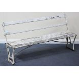 A 20th Century white painted cast metal steamer bench with two-way moving back and wooden slatted