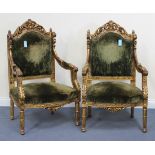 A pair of 20th Century French gilded fauteuil armchairs with carved frames, the seats and back