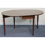 A 20th Century mahogany oval drop-flap dining table, raised on turned legs and pad feet, length