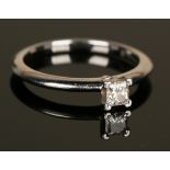 A Tiffany & Co platinum and diamond single stone ring, claw set with a princess cut diamond,