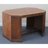 An Art Deco walnut centre table, the canted rectangular top inset with a burr central panel,