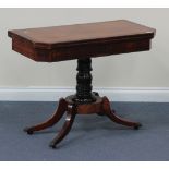 A Regency mahogany card table with rosewood crossbanded borders, the hinged top with canted corners,