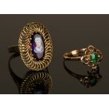 A gold ring, mounted with an oval cabochon jade within a pierced surround, ring size approx L, and